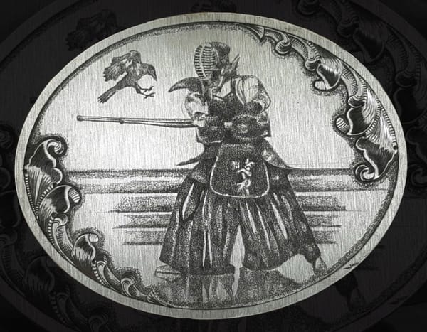 Owalna płytka z grawerowanym samurajem i ptakiem