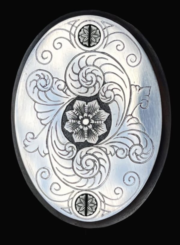 Griffkappe mit gravierter Rosette und Spiralornament