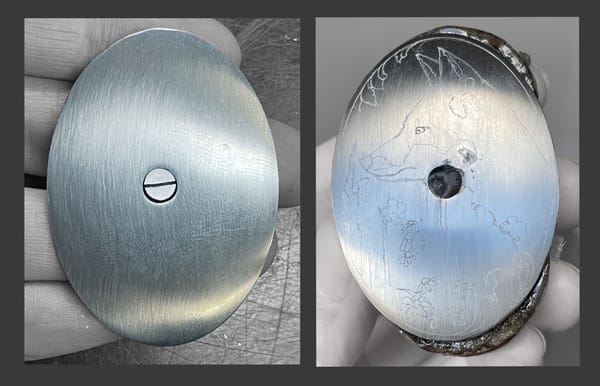 Plain grip cap with a screw before engraving and the first sketch of the fox