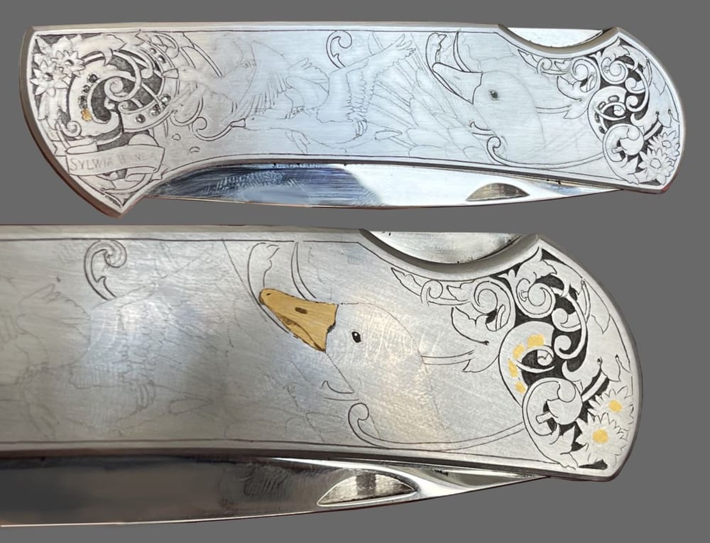 Folding knife after gold inlay of the beaks and scrollwork details