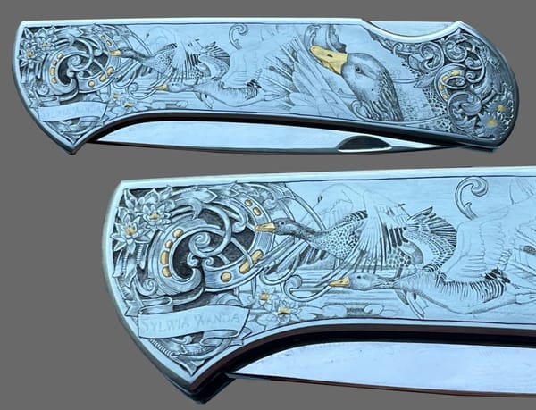 Finished engraving of geese and scrollwork on the folding knife