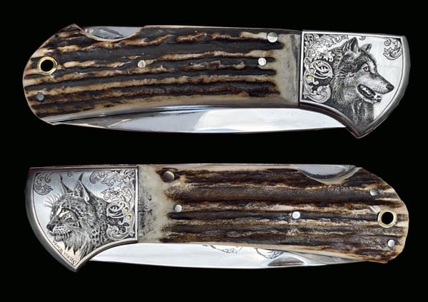 Klappmesser mit Griffschalen aus Geweih und gravierten Backen